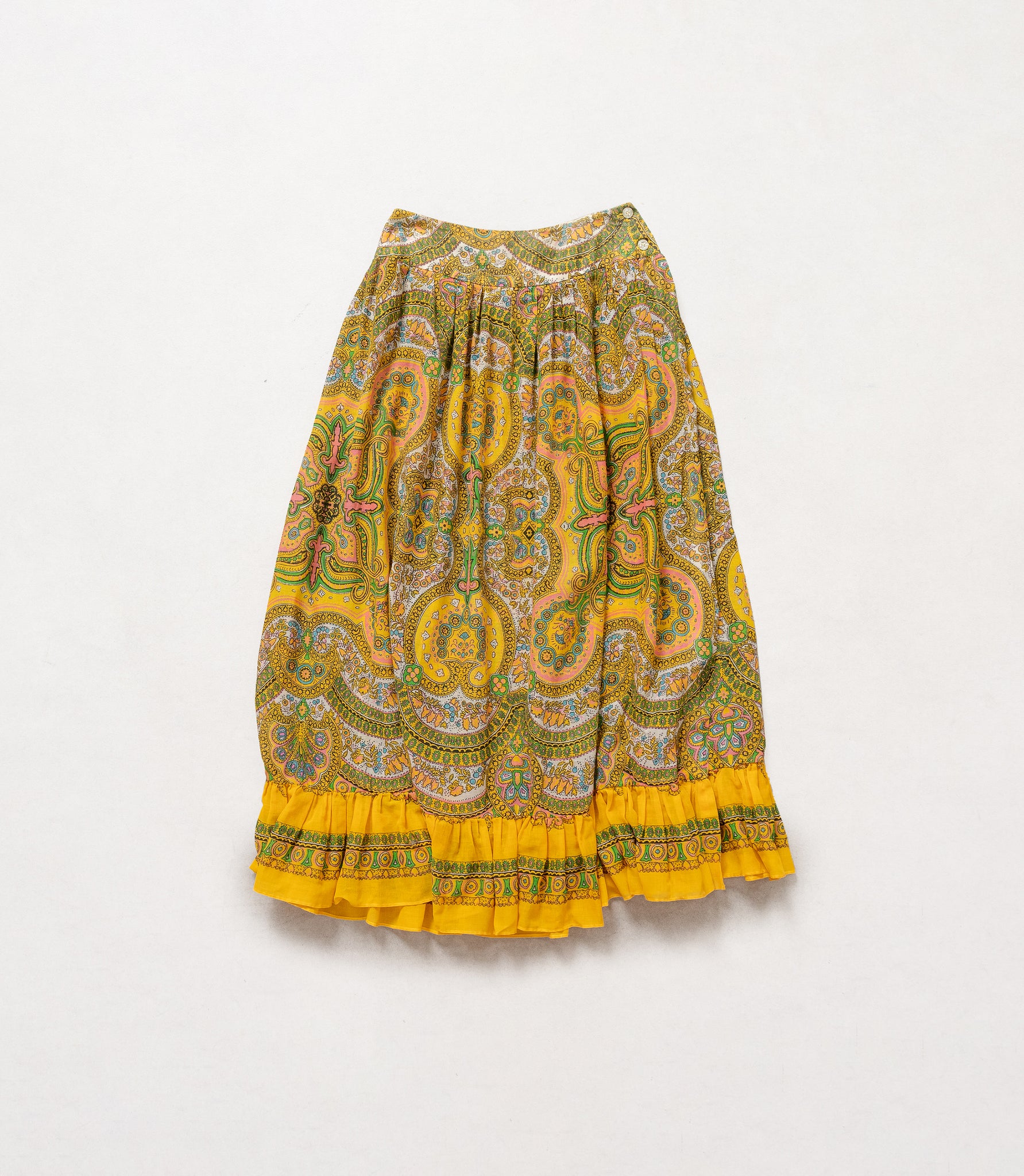 Yellow patterned skirt on a white background