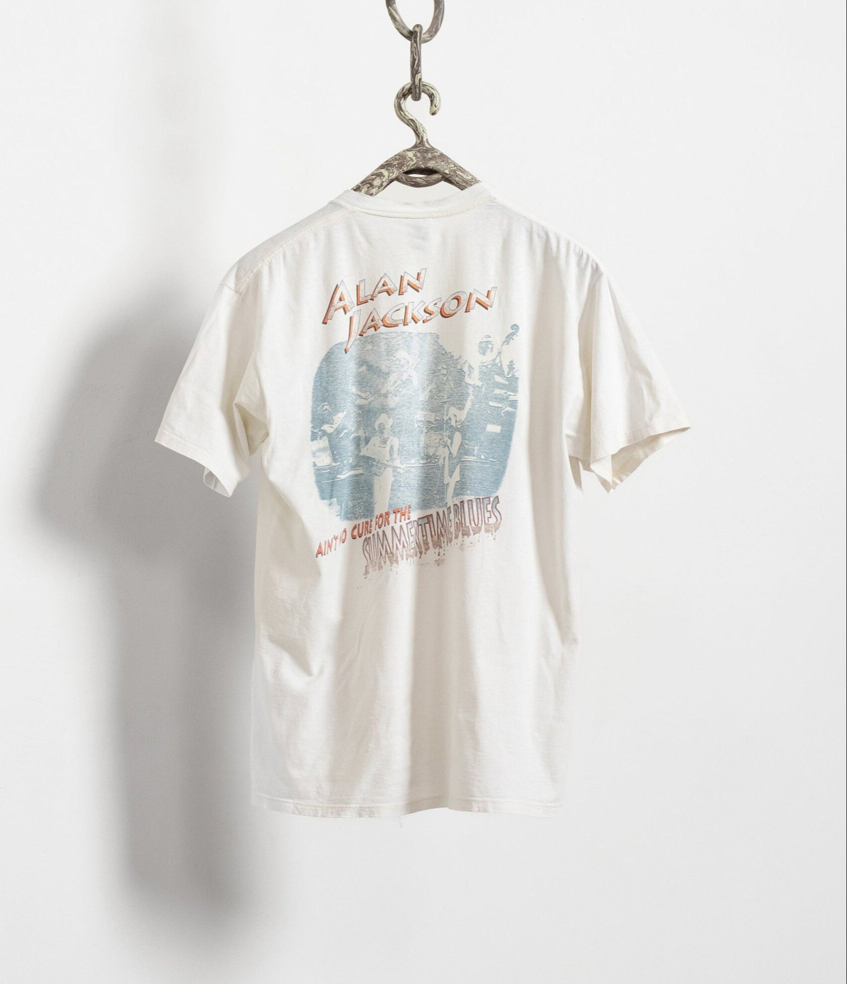 White t-shirt with graphic design and text on a white background