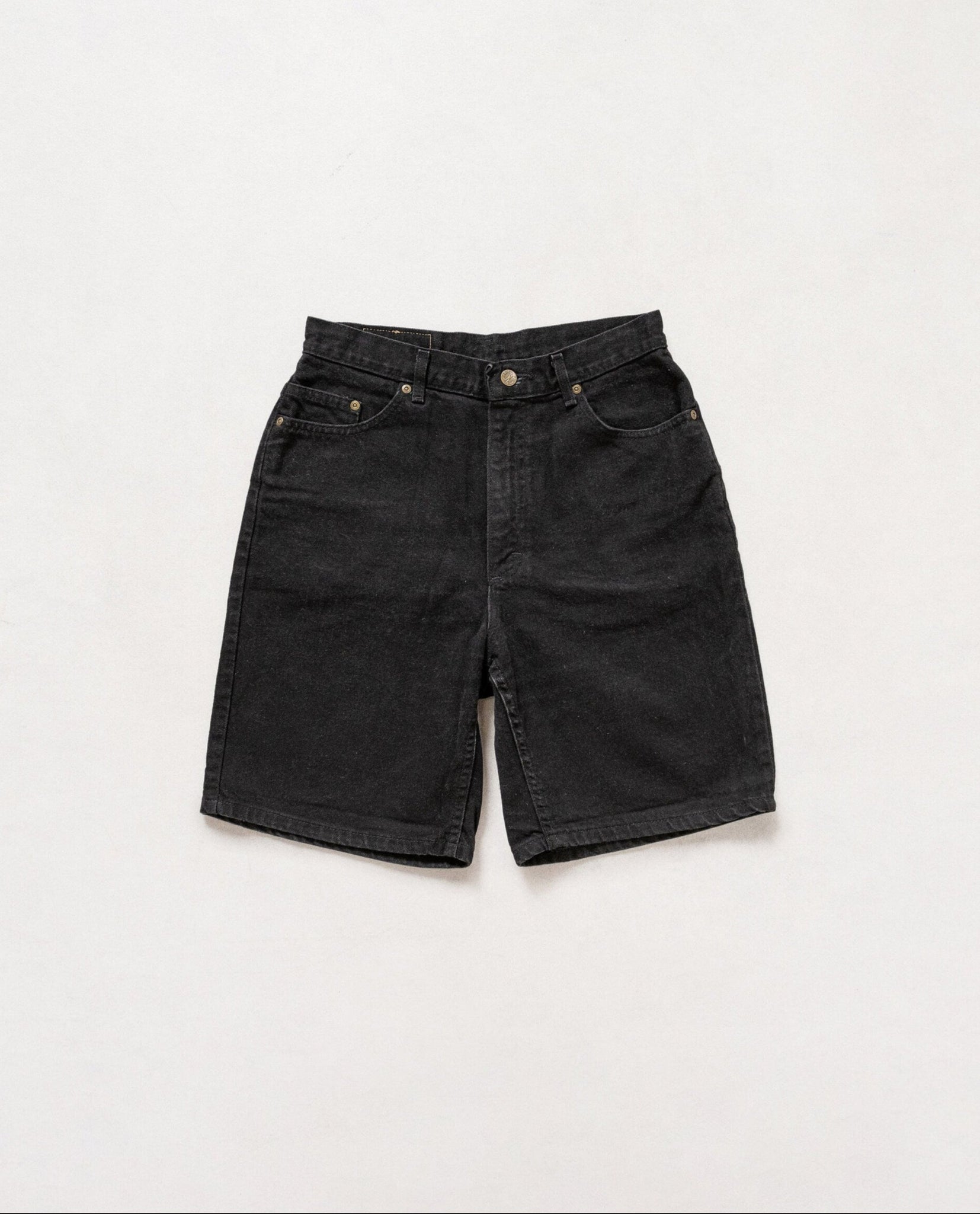 Black denim shorts on a white background