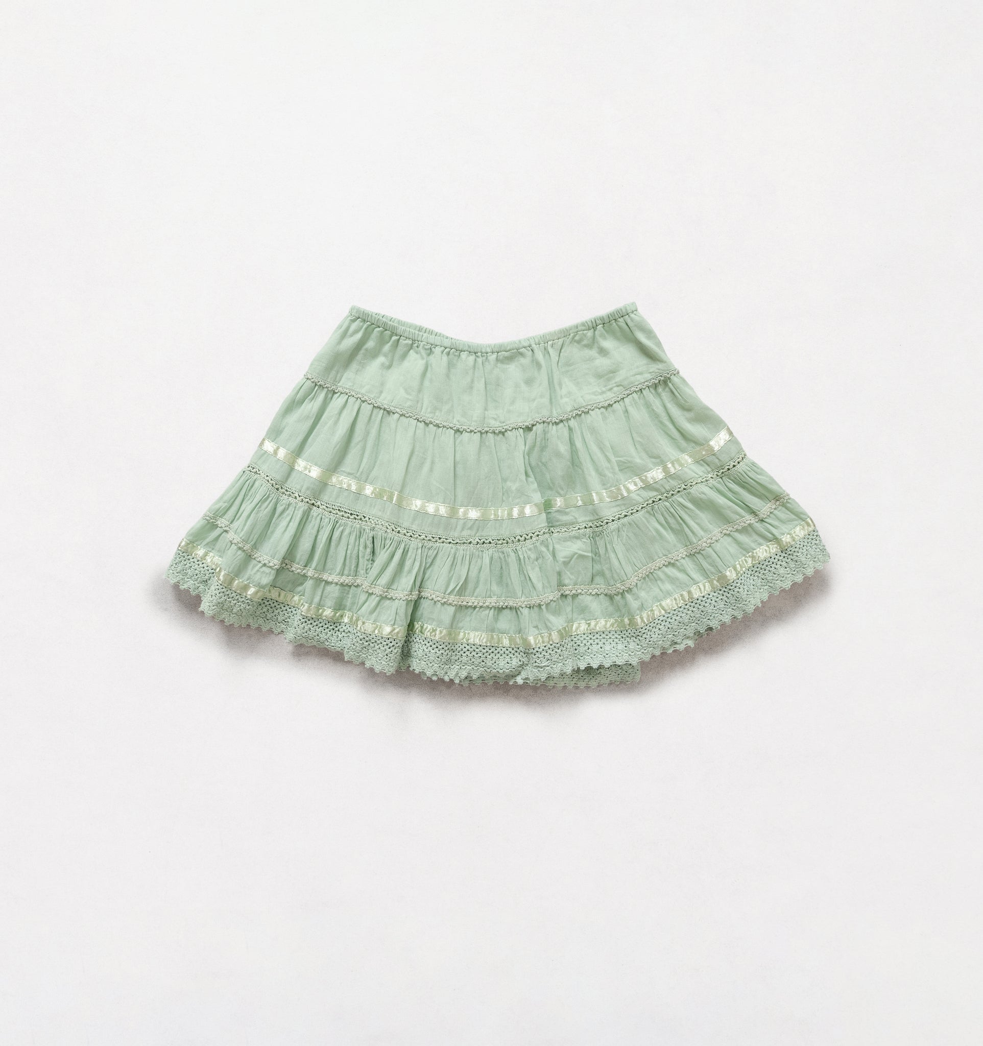 Green tiered skirt on a white background