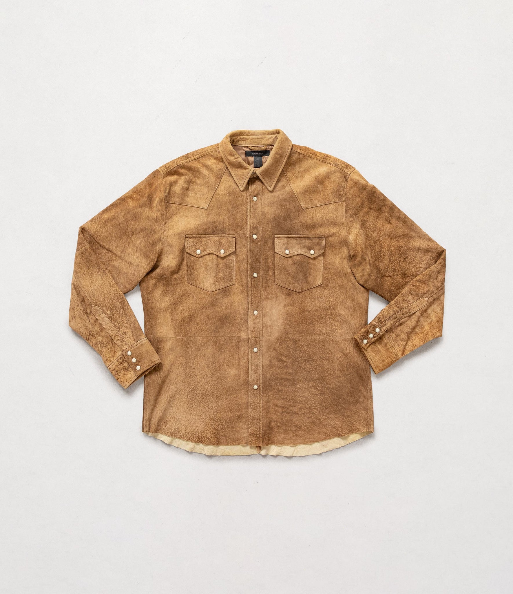 Brown suede shirt on a light gray background