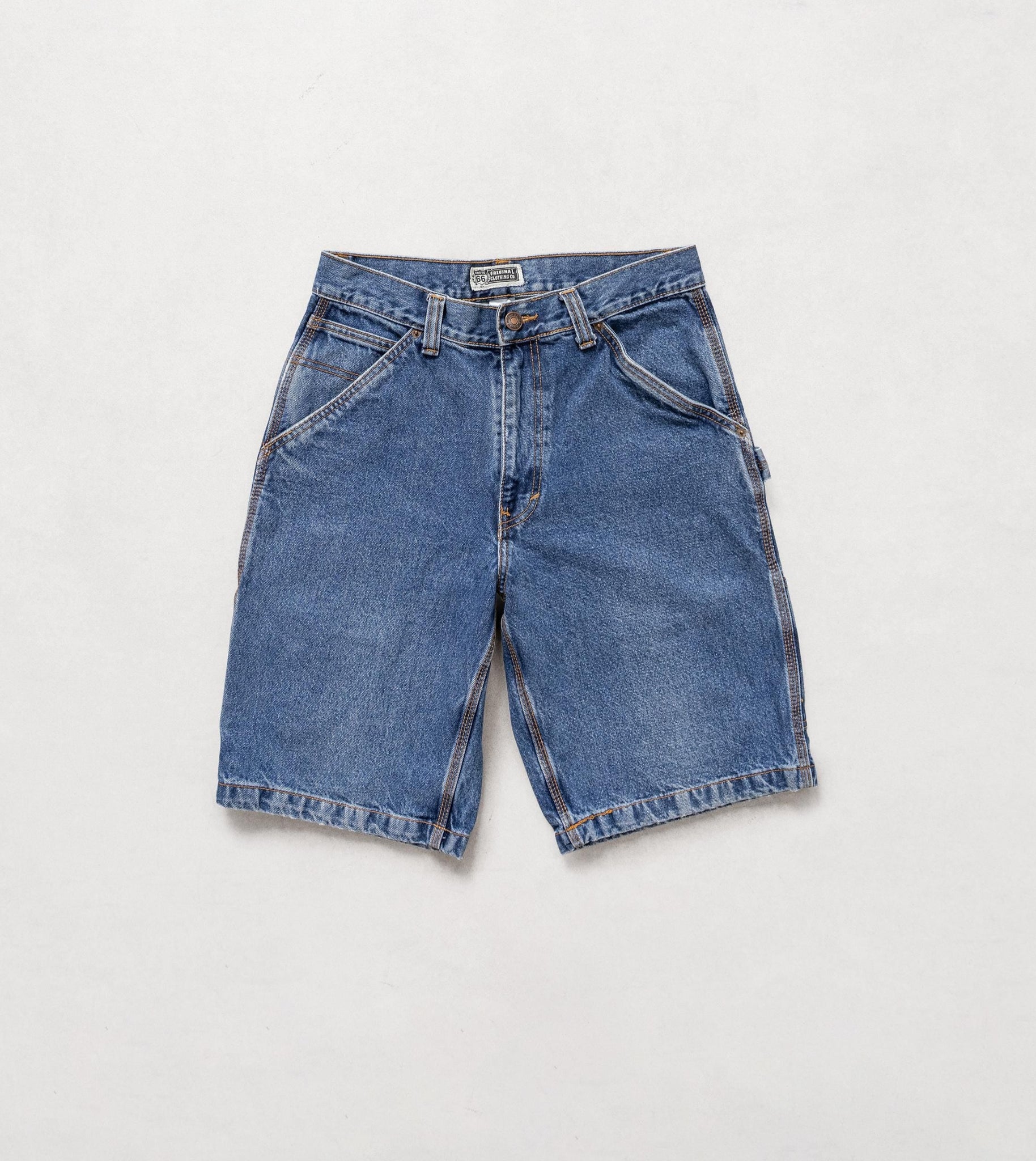 Blue denim shorts on a light gray background