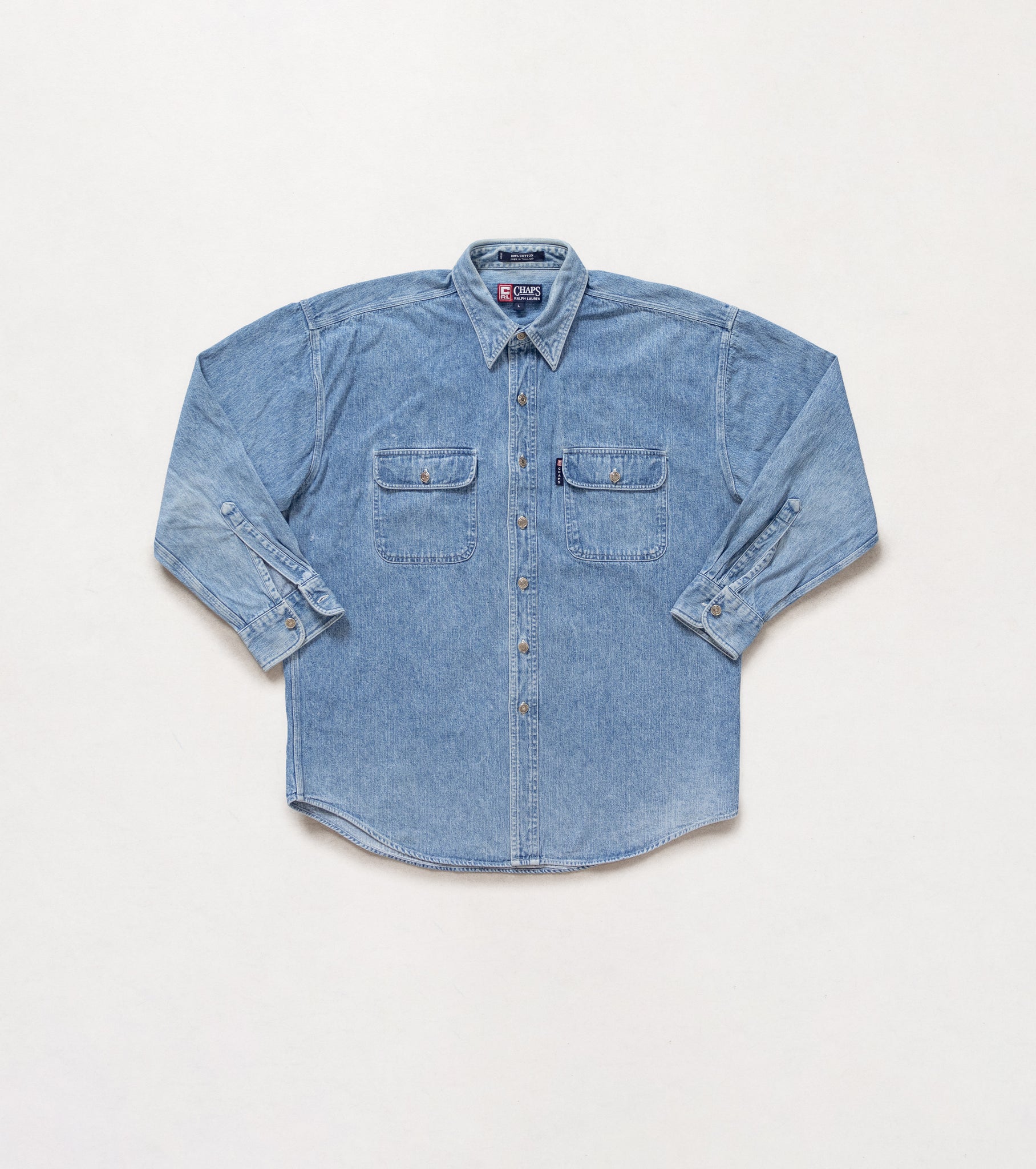 Blue denim shirt on a white background