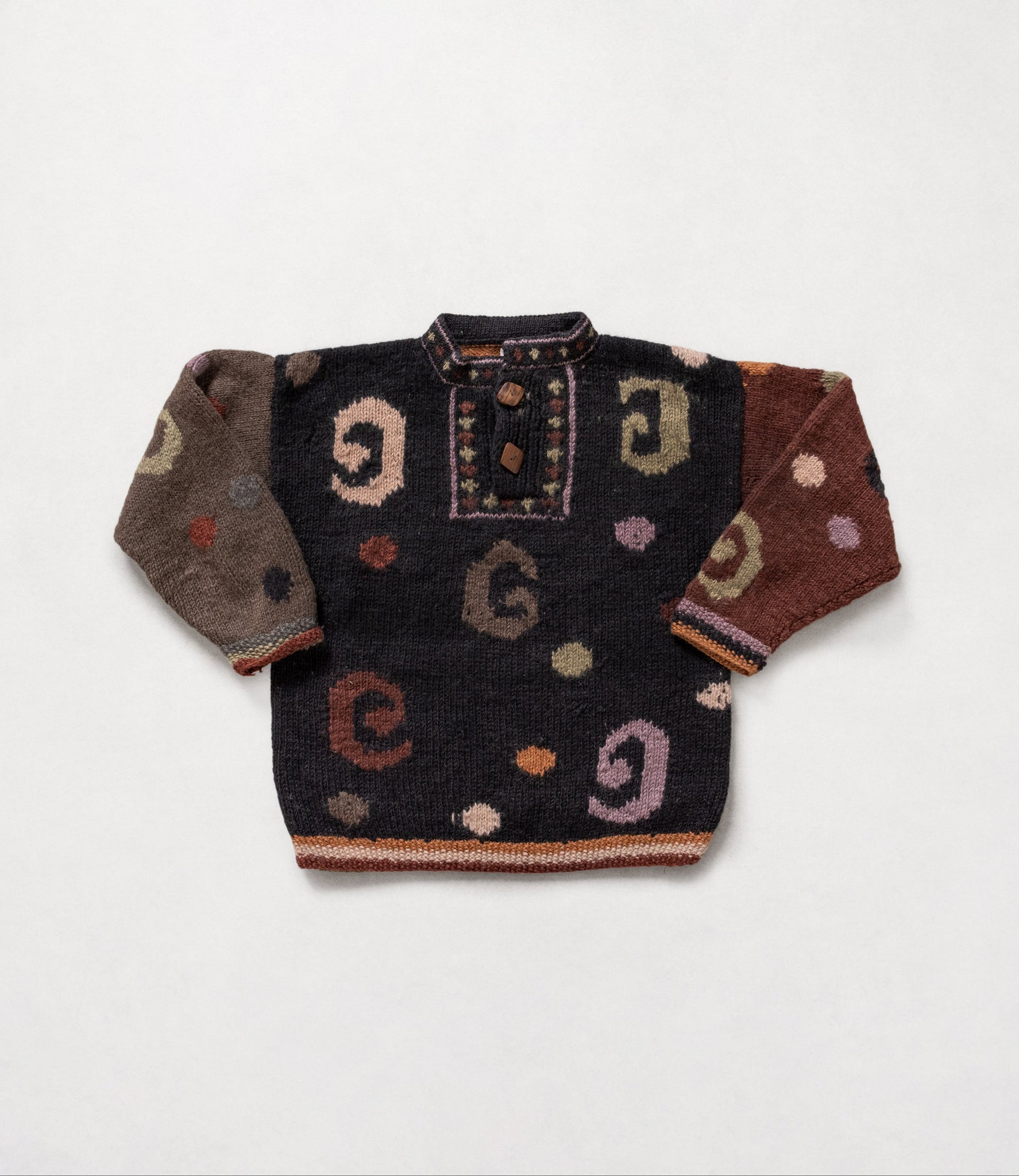 Vintage 90's knit button collar pullover sweater with a multicolor pattern, featuring two large wooden buttons at the collar.