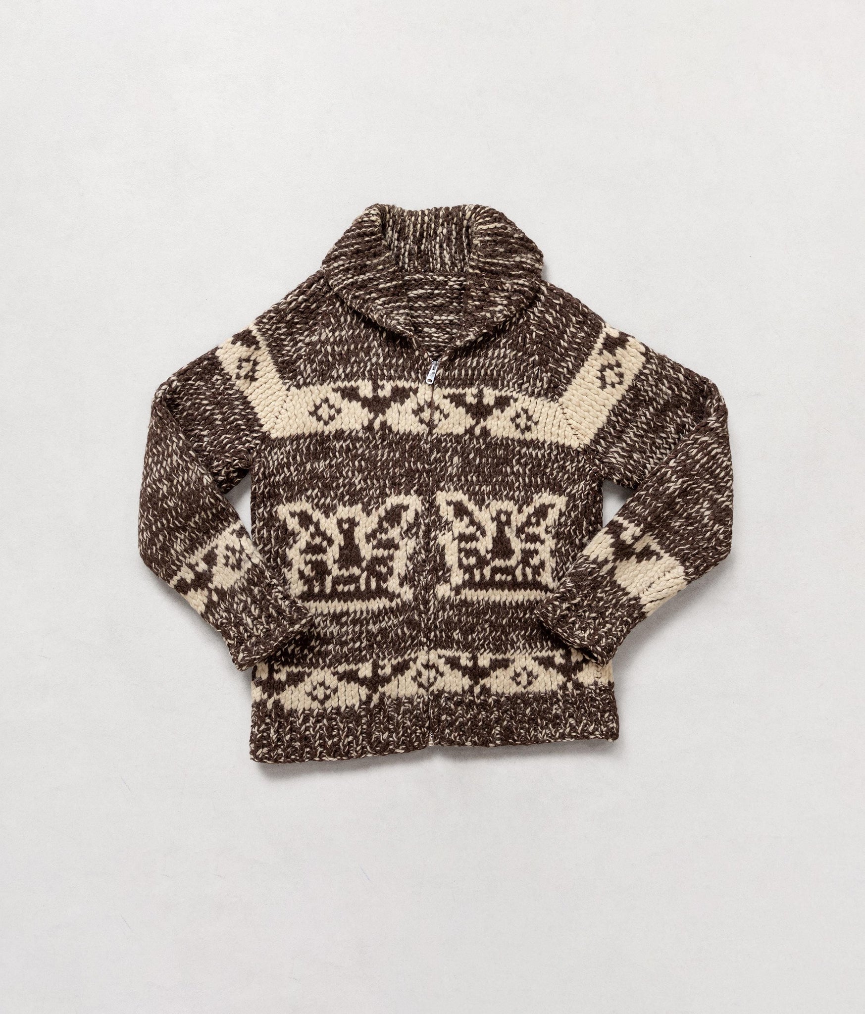 Knitted sweater with a pattern on a light gray background