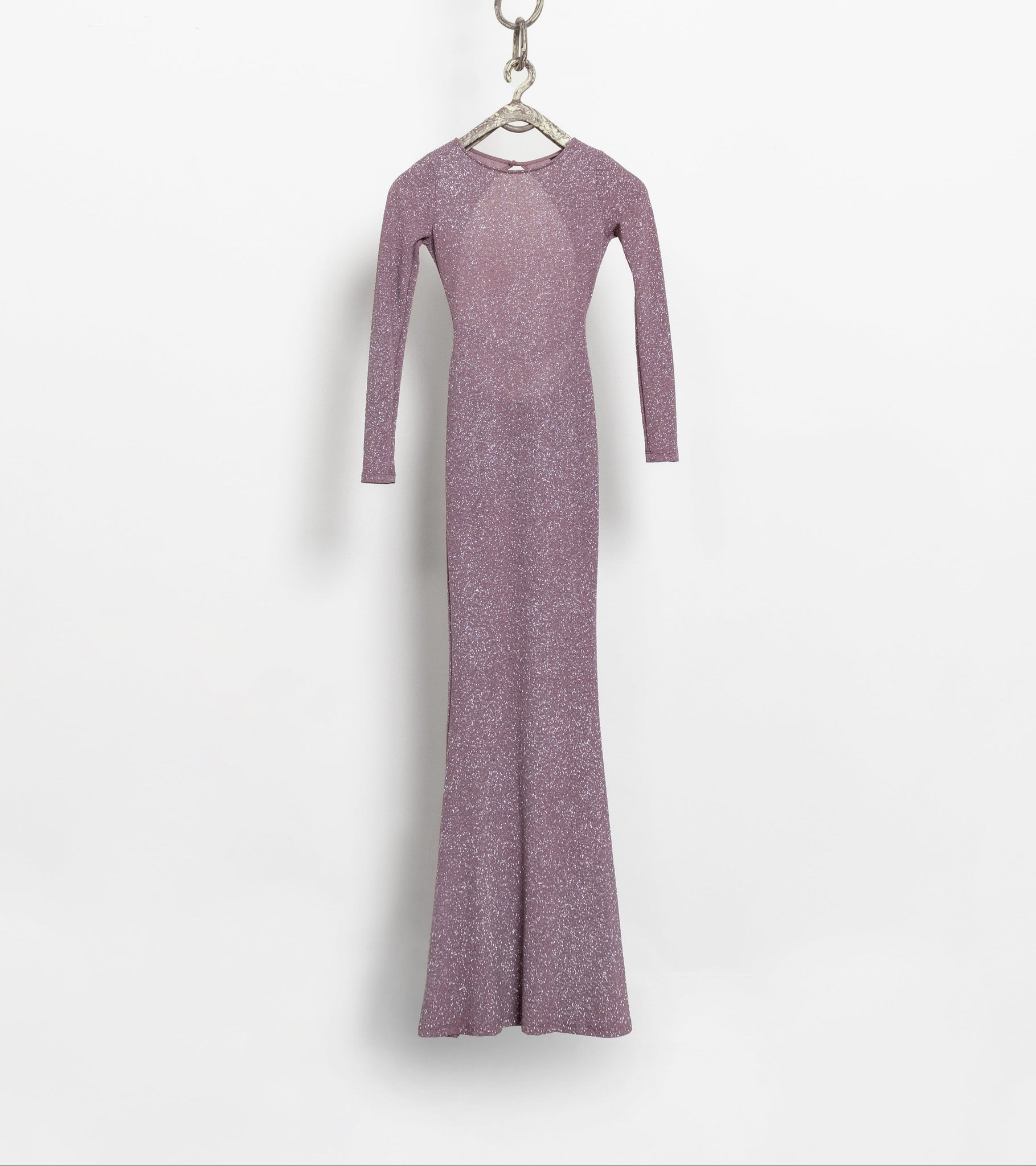 A long sleeve pink metallic maxi dress with a plunging back, displayed on a hanger against a white background.