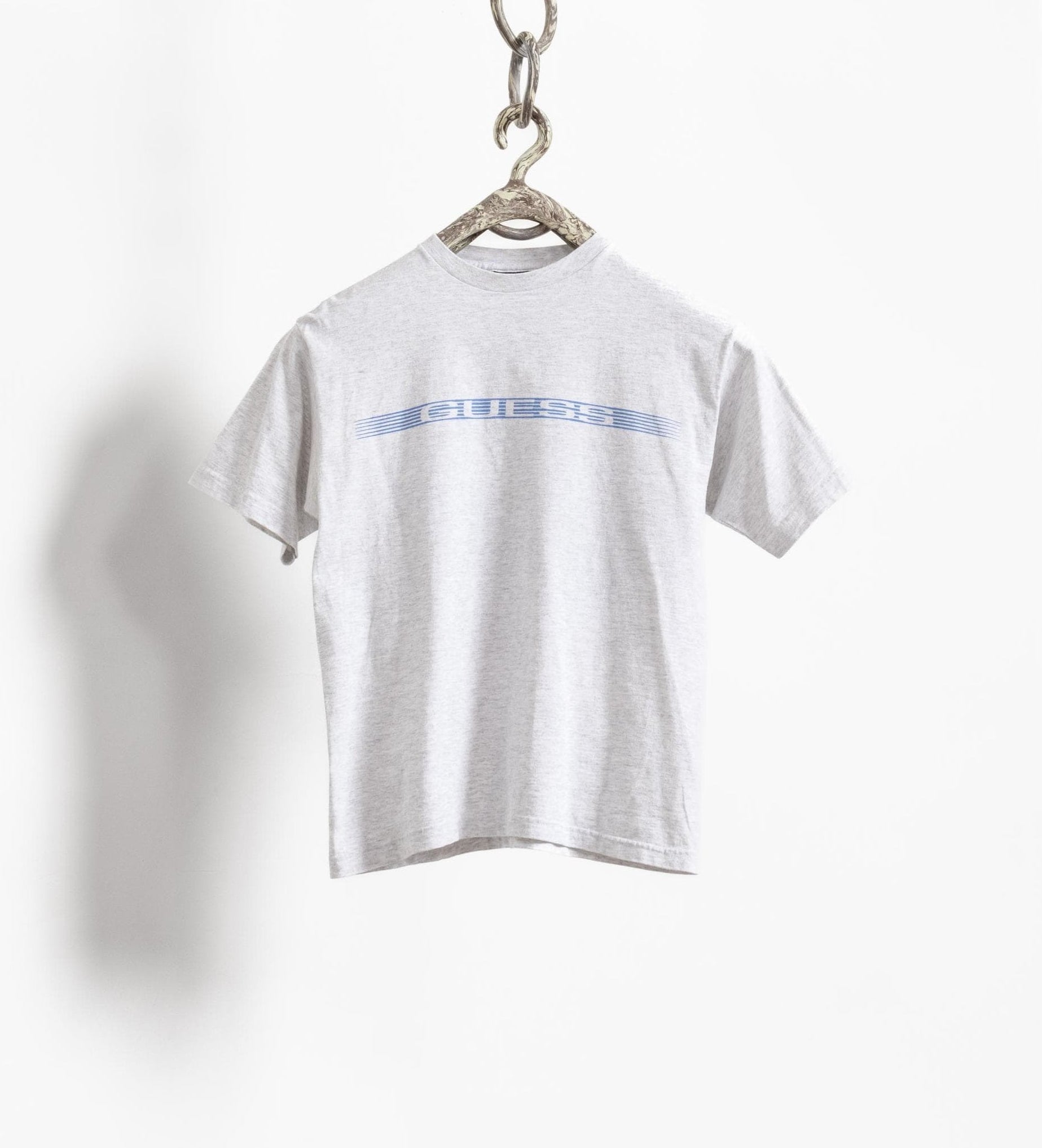 White t-shirt with blue text on a white background