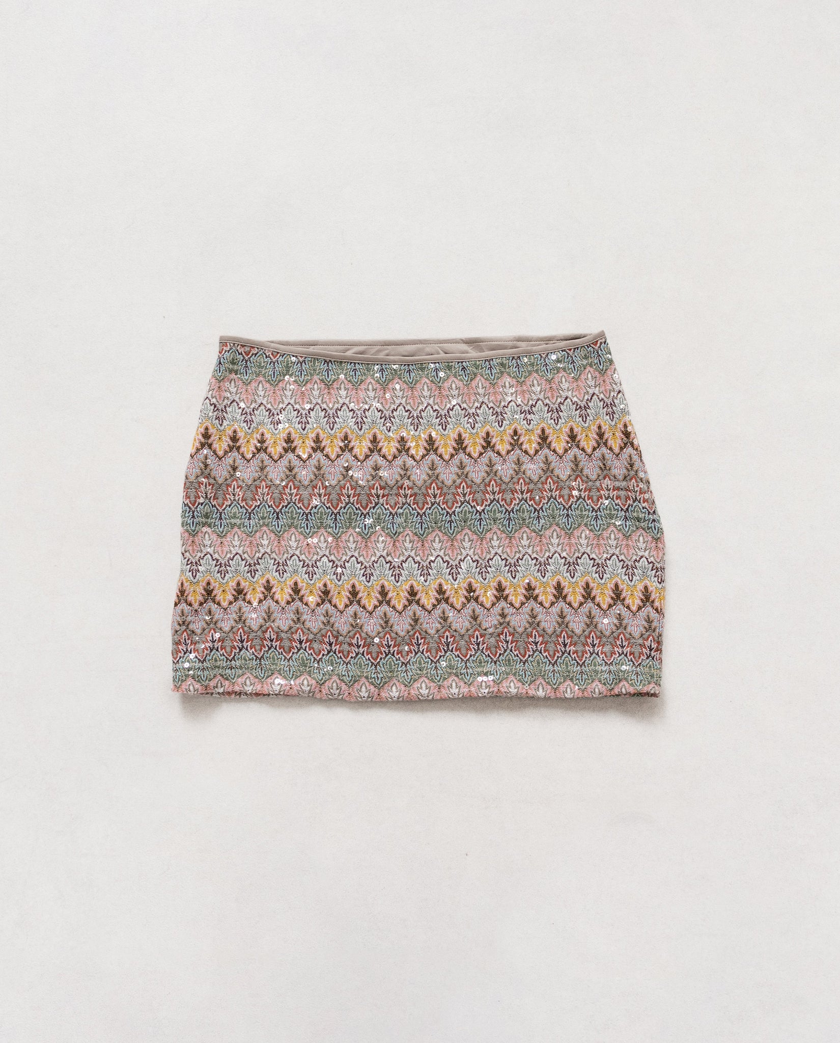 Patterned mini skirt on a light gray background