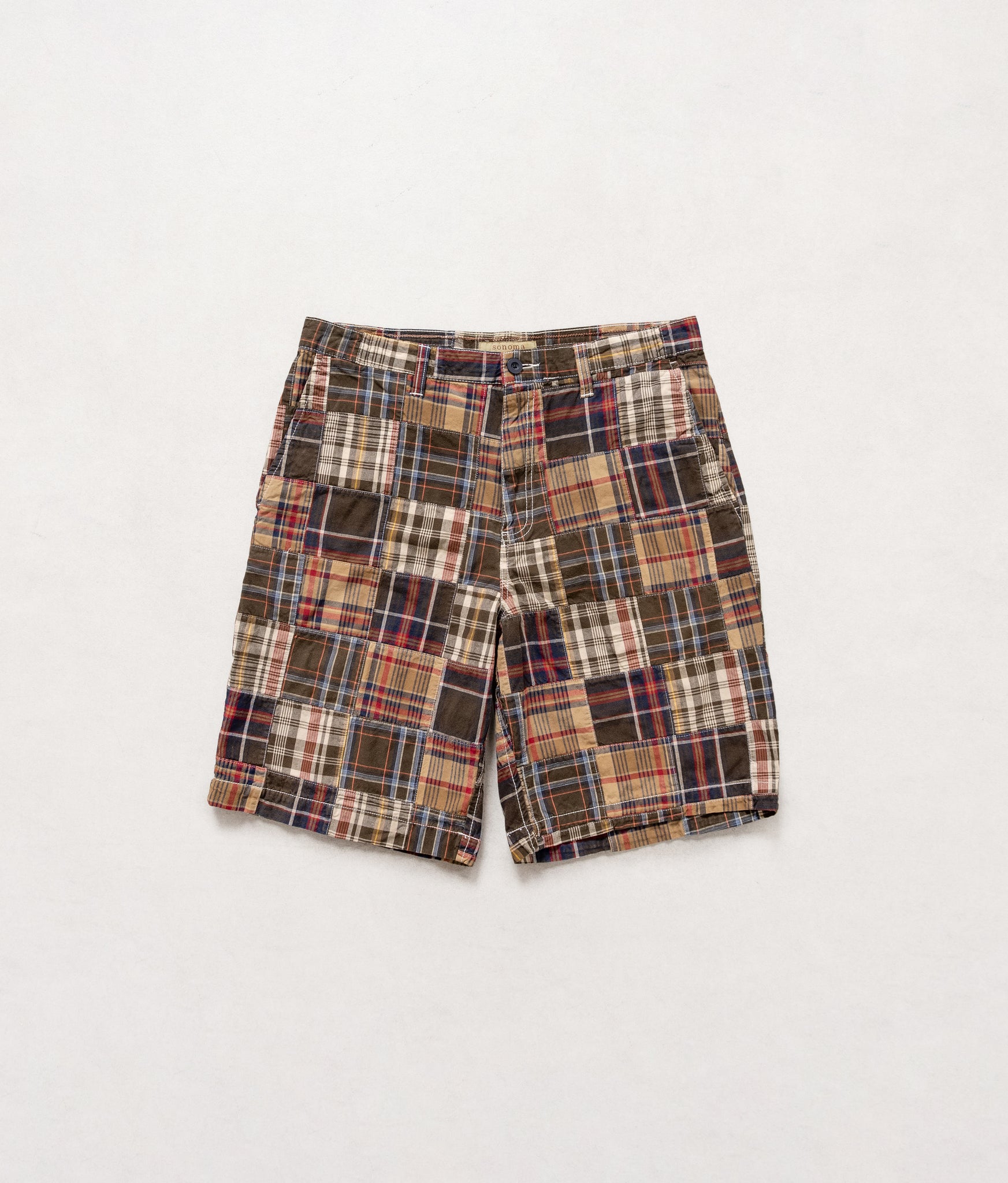 Plaid shorts on a light gray background