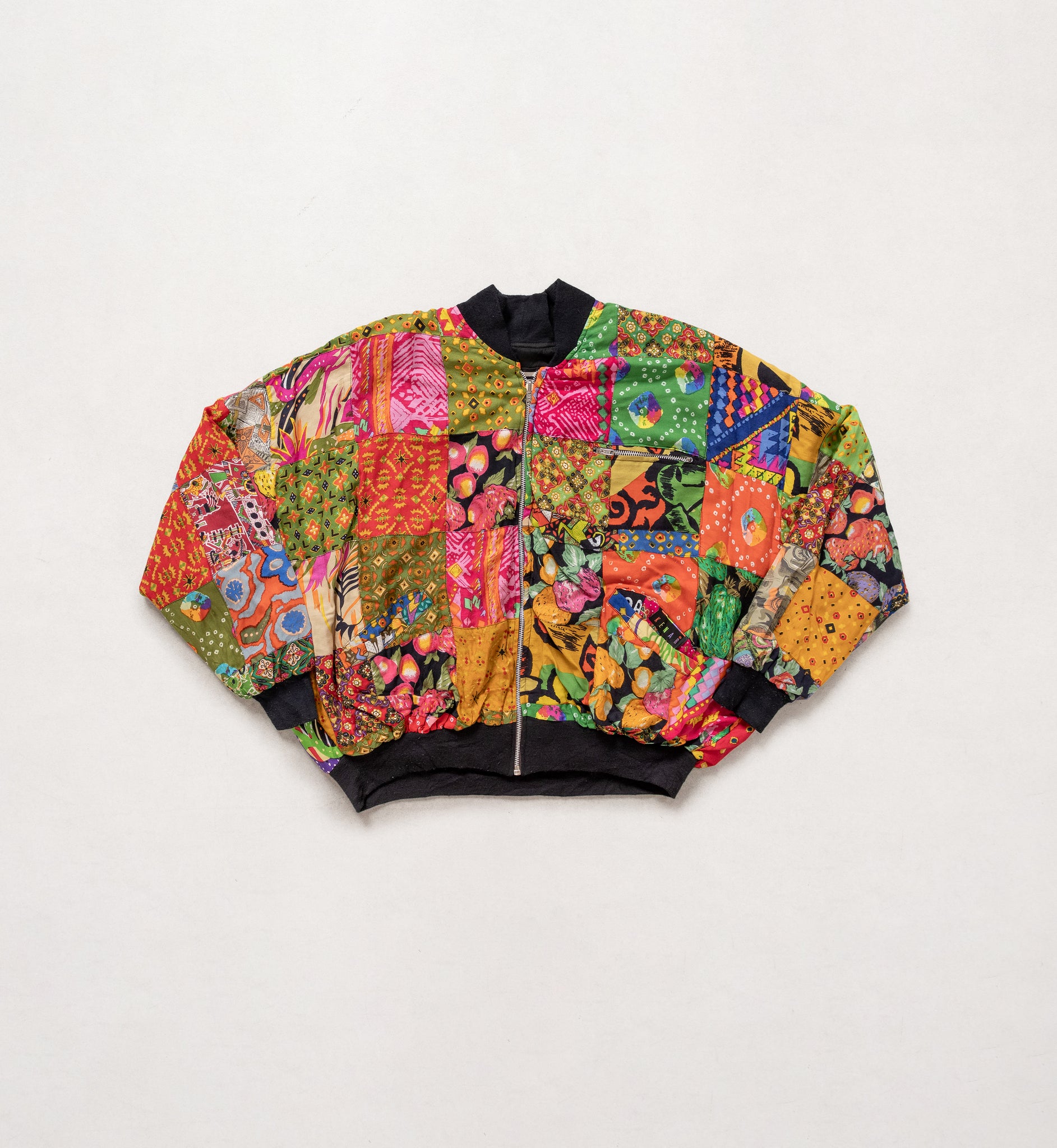 Colorful patchwork jacket on a light gray background