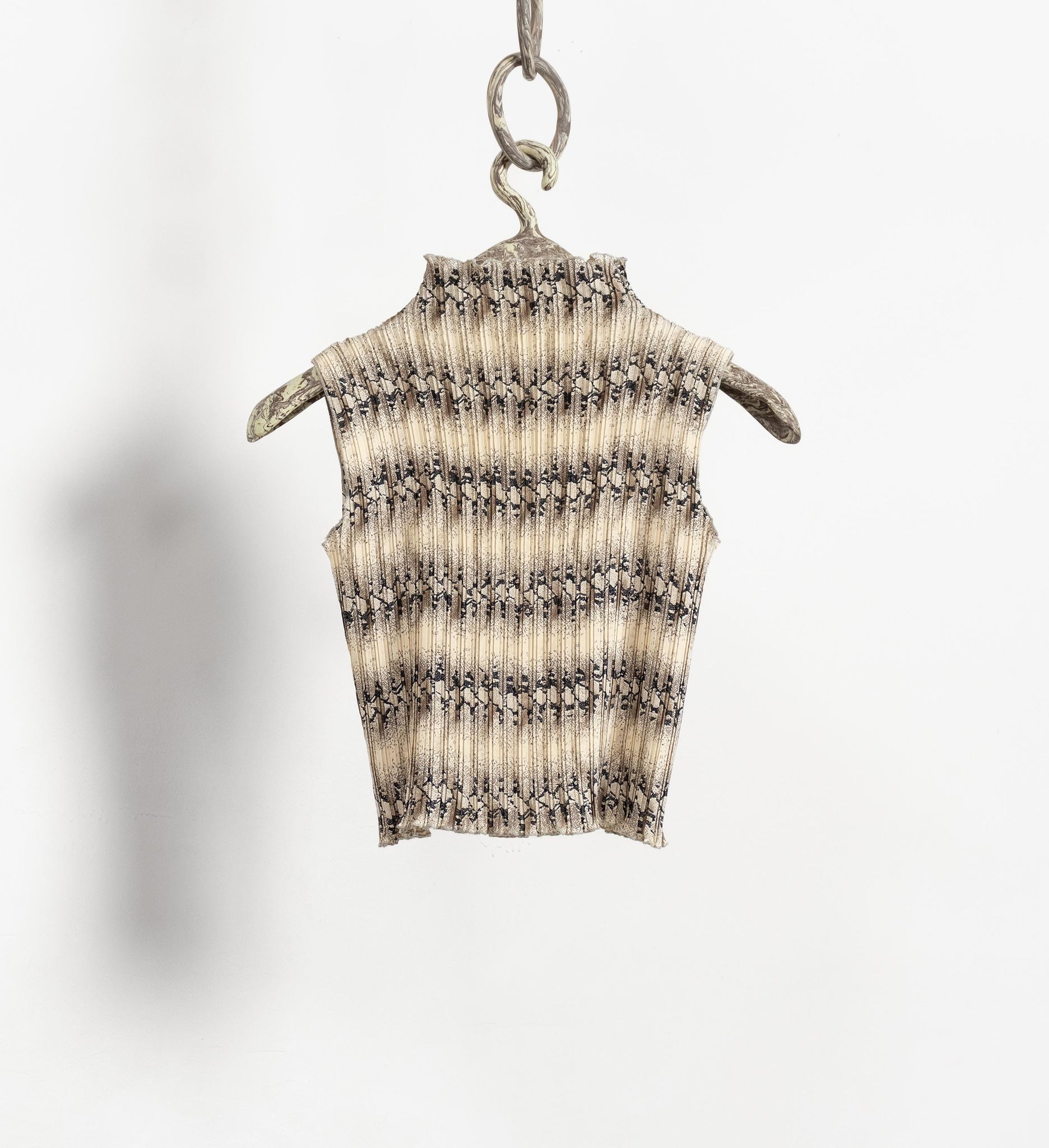 Striped ribbed knit sleeveless top on a hanger against a white background