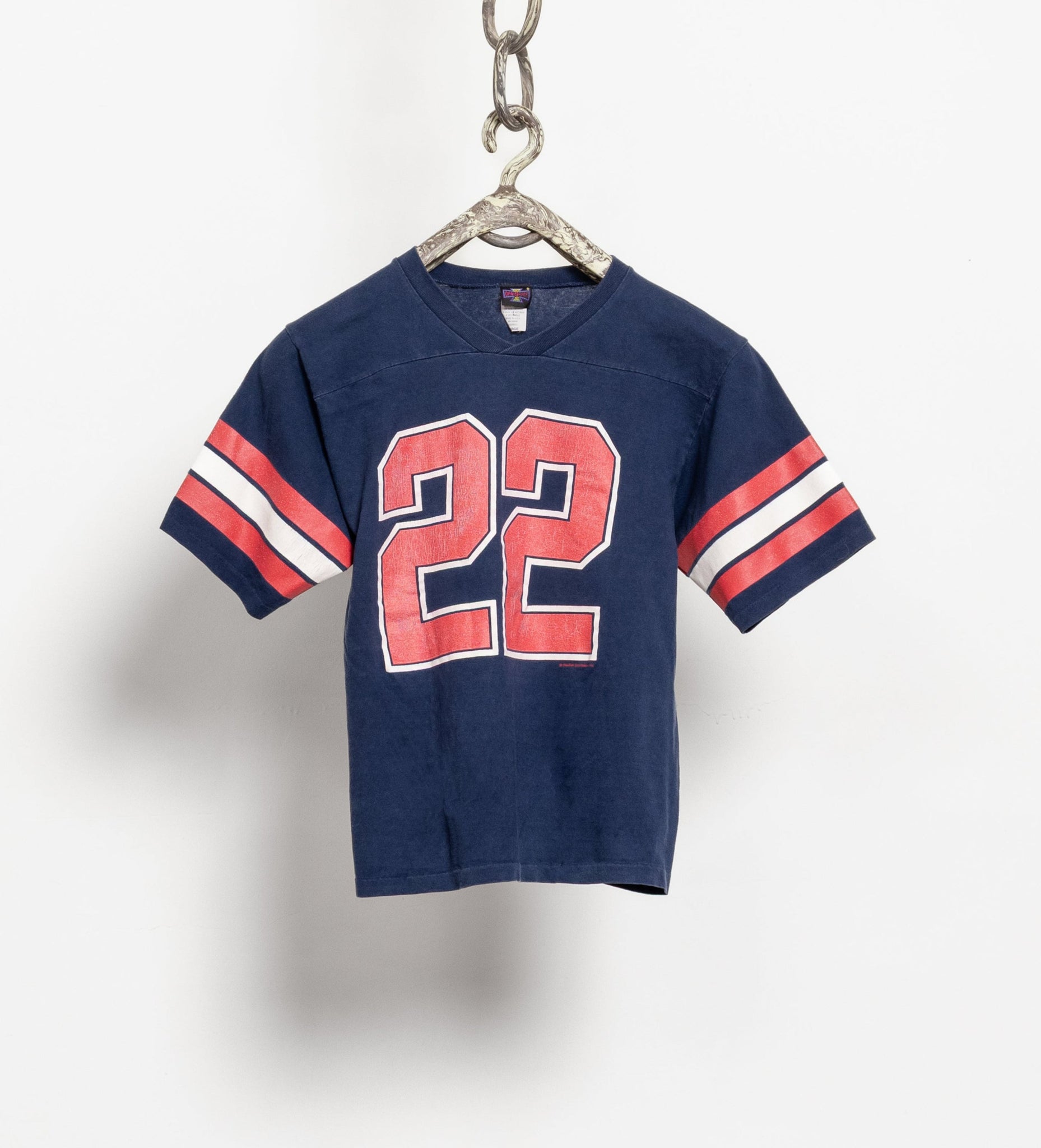 Vintage 90's navy, red, and white half sleeve jersey with the number 22 printed on the front.