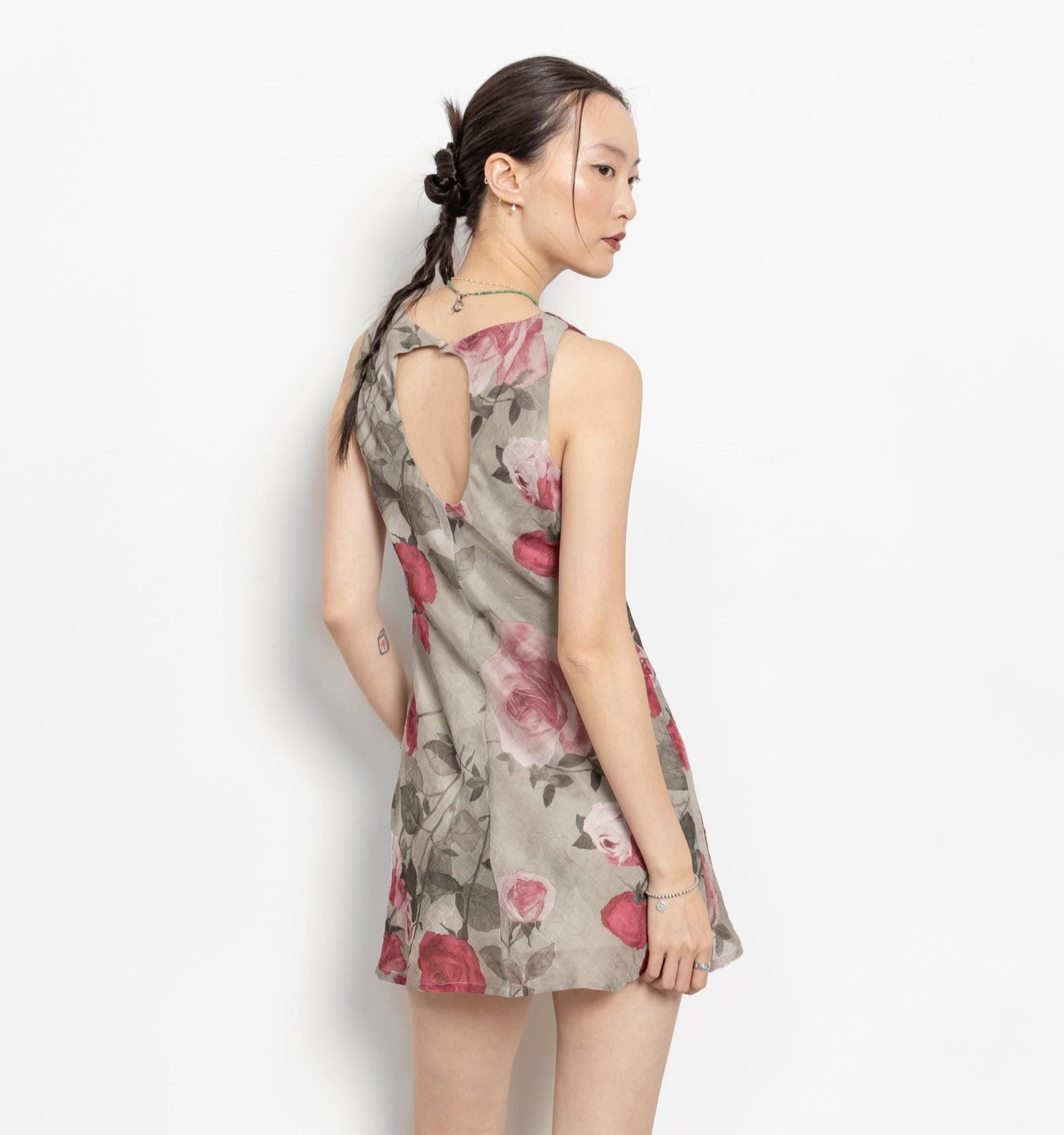 Woman wearing a floral dress on a white background