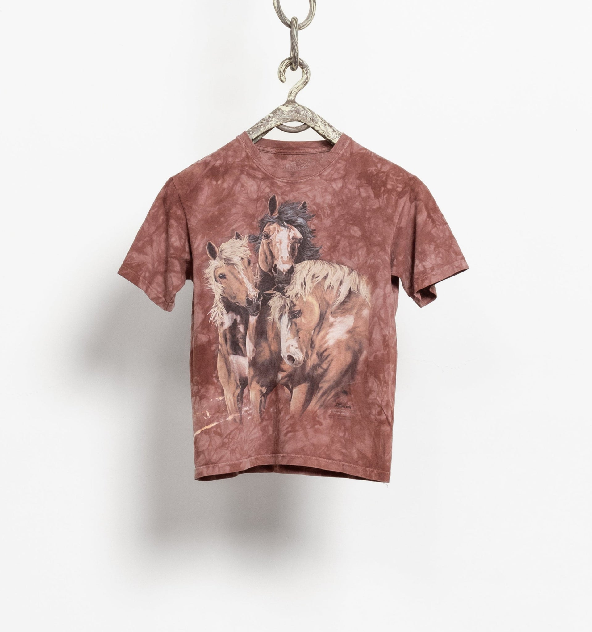 Vintage 90's brown tie-dye t-shirt with a graphic of wild horses on the front.