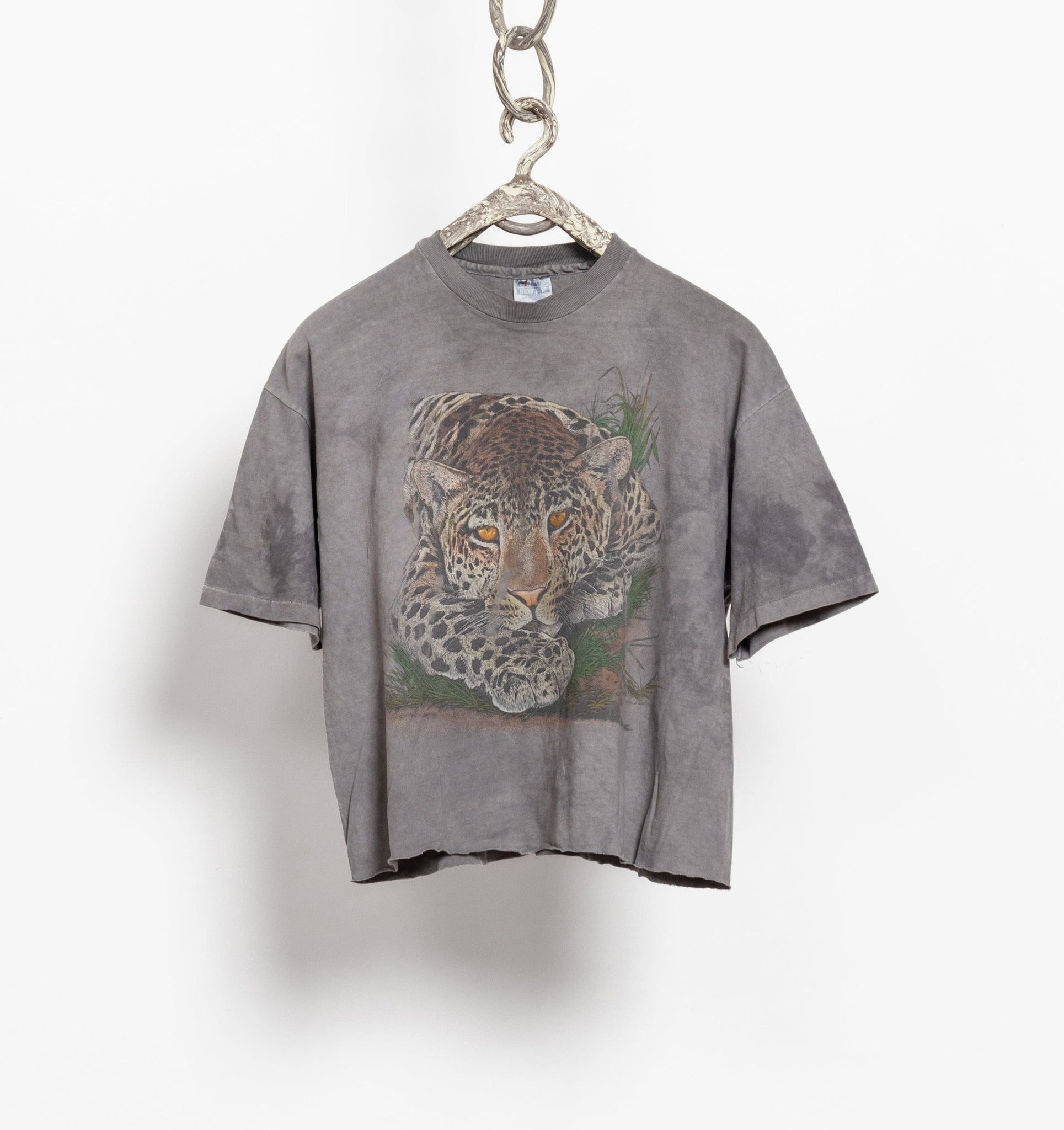 A vintage 90's gray tie dye leopard graphic t-shirt with a crew neck.