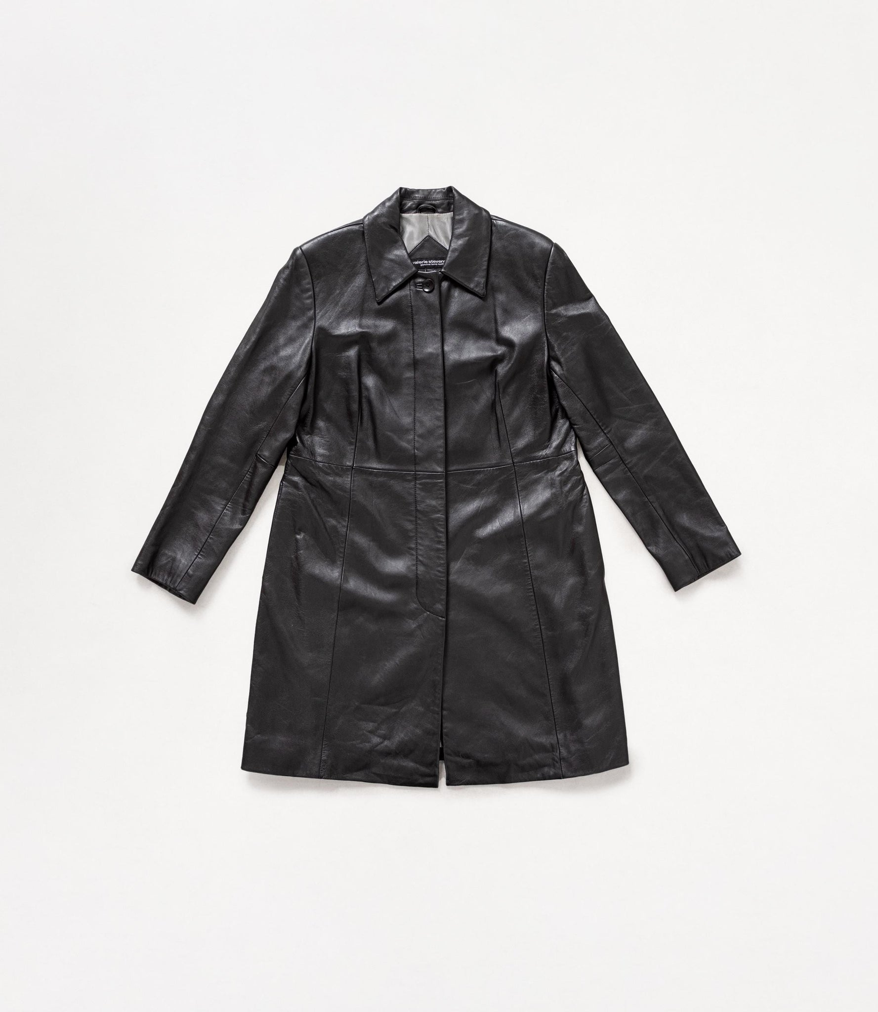 Black leather coat on a light gray background