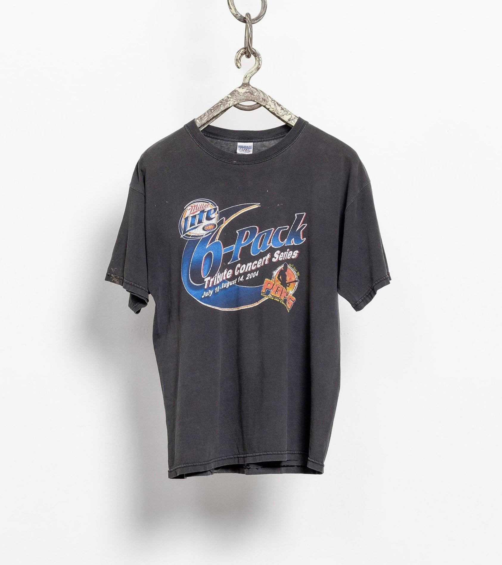 Vintage Miller Lite concert tee hanging on a chain, with graphic text and logo on the front.