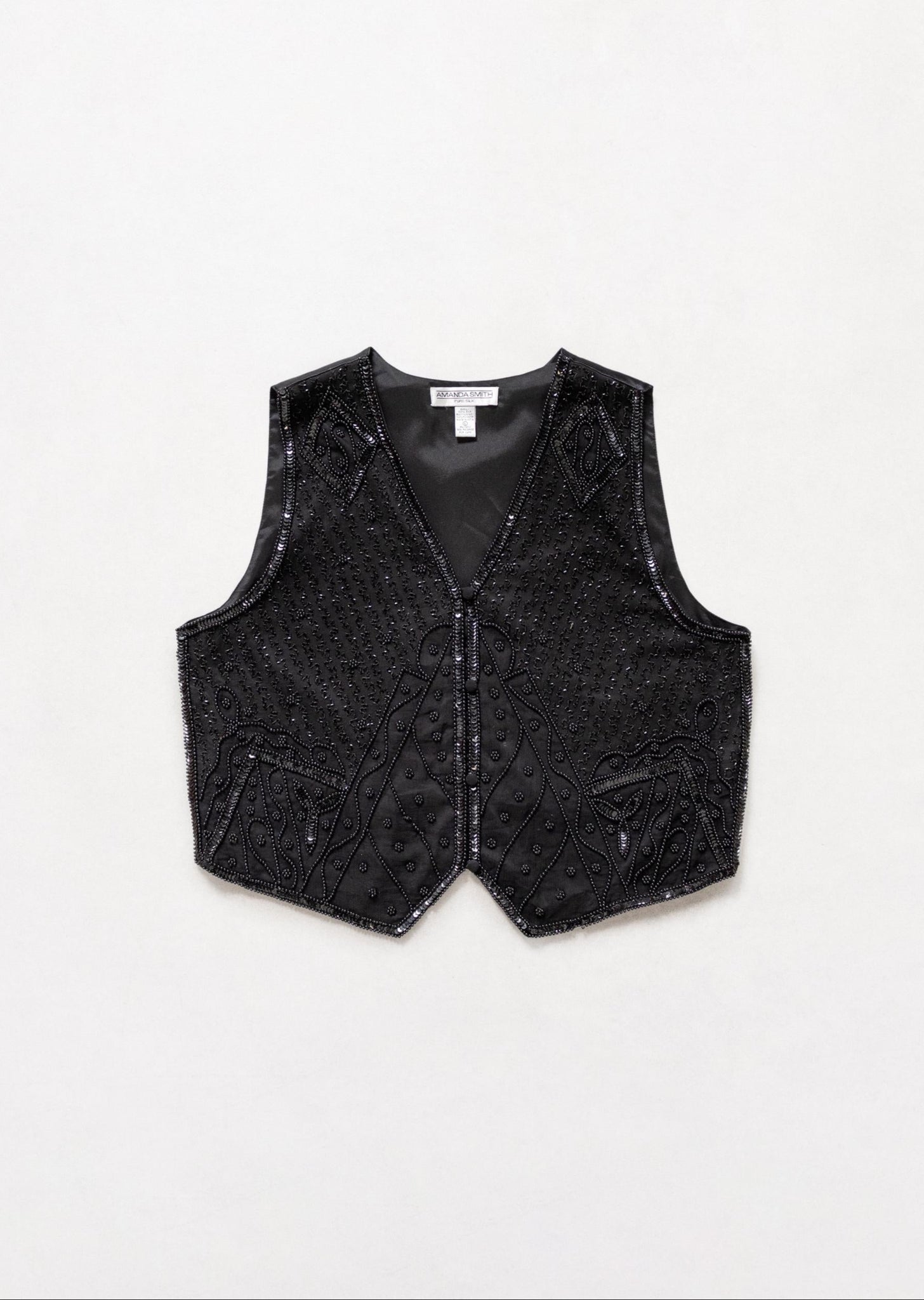 Black vest on a white background