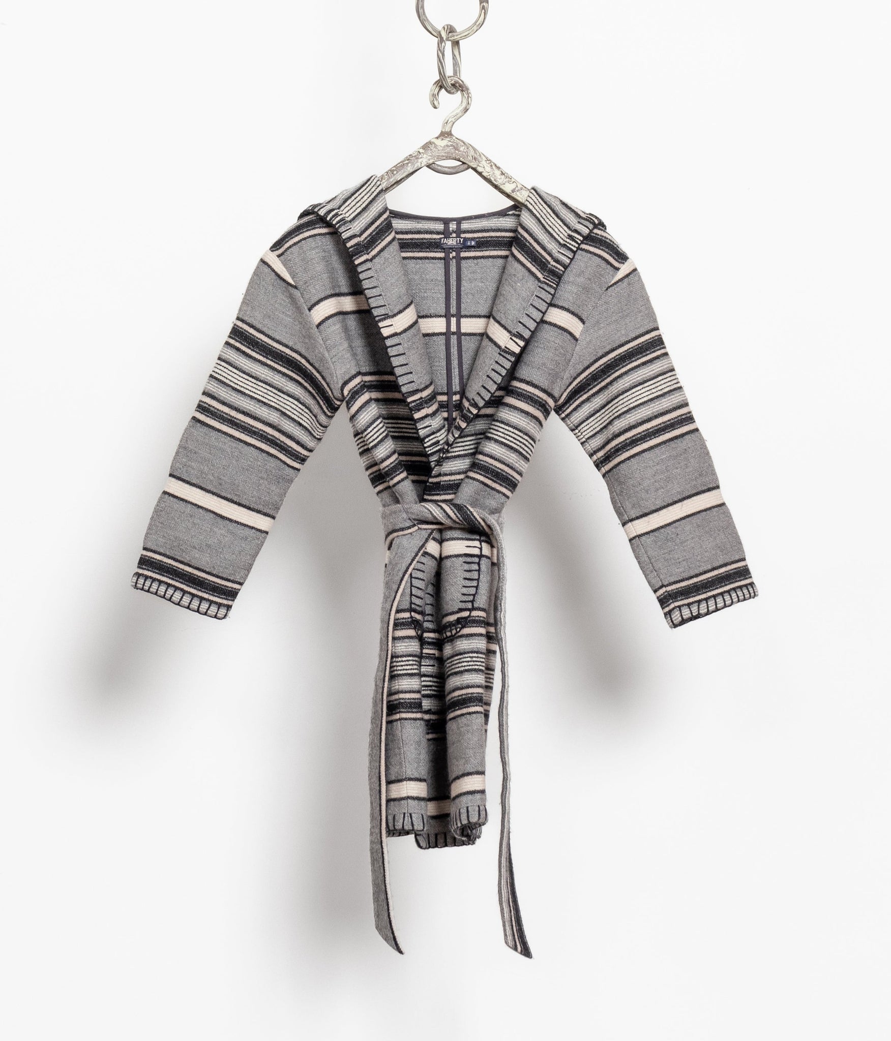 Plaid robe on a hanger against a white background