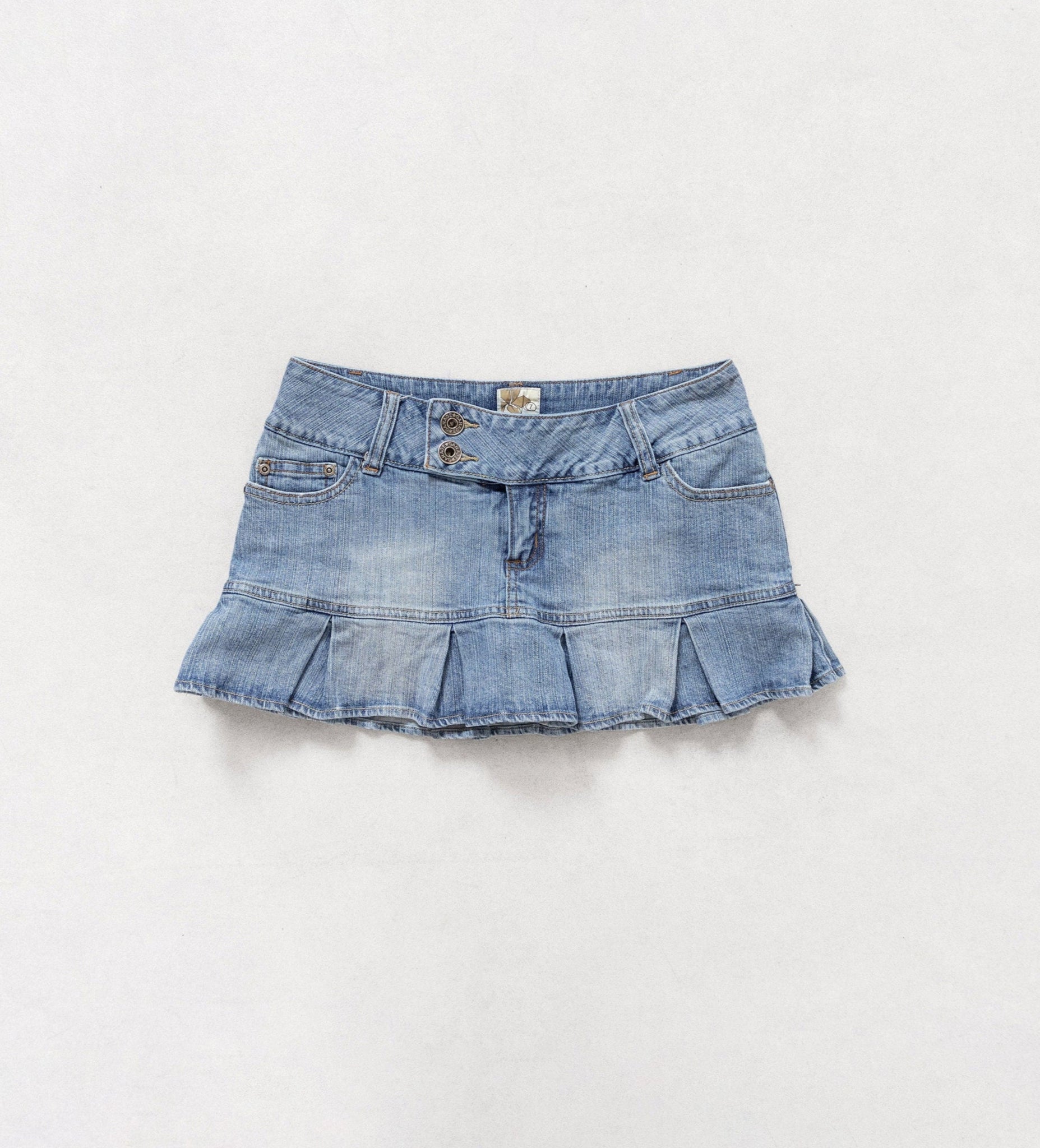 Denim skirt with ruffled hem on a white background