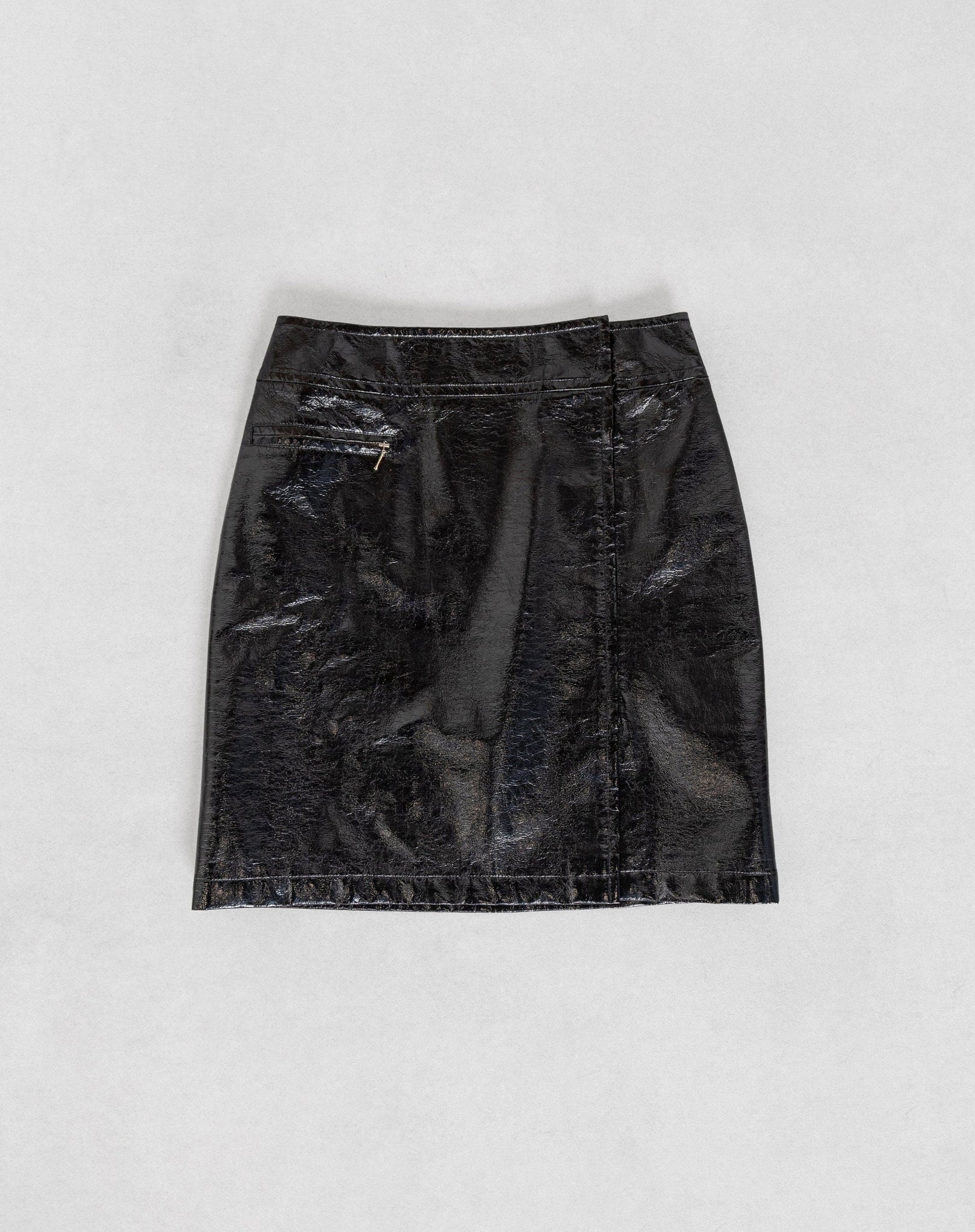Black leather skirt on a light gray background