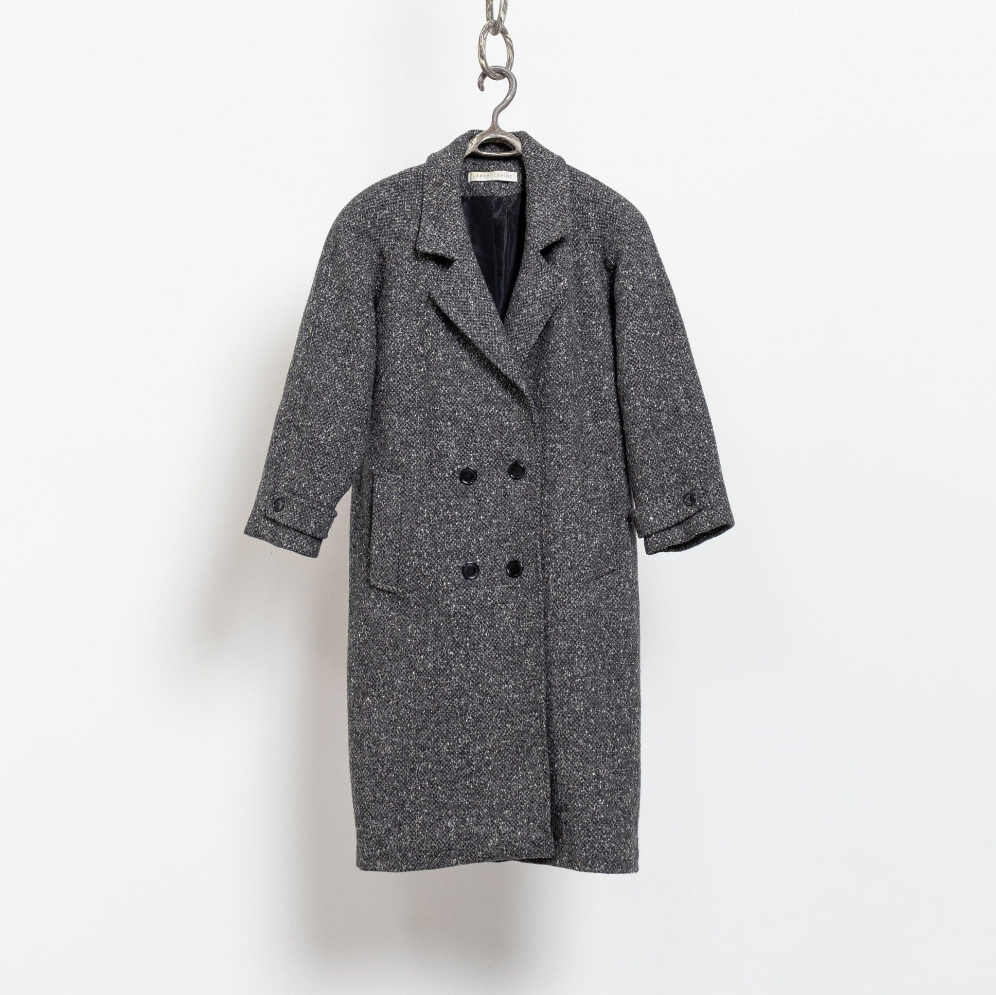 Gray coat on a hanger against a white background