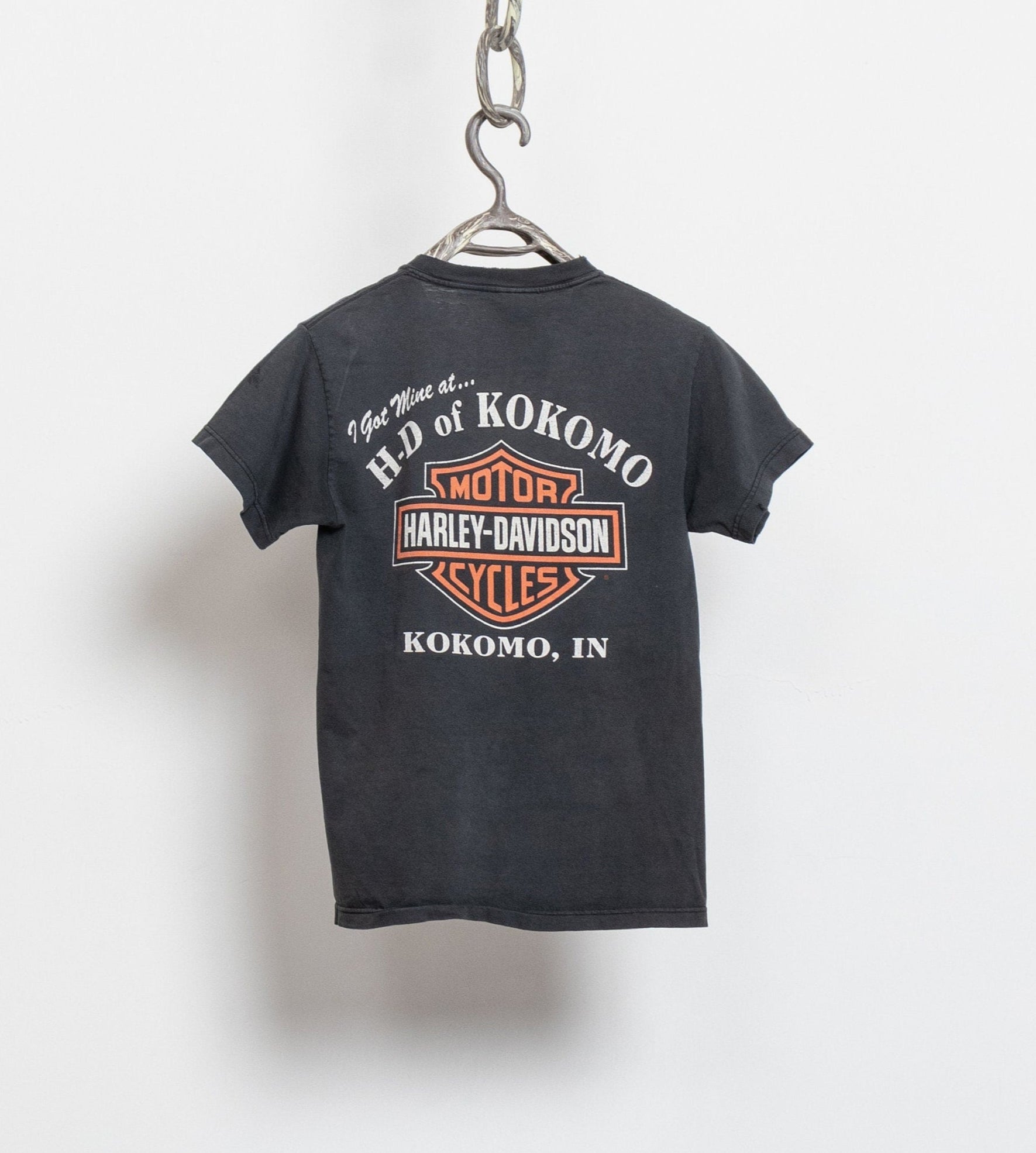 Black t-shirt with Harley-Davidson logo and text on a white background