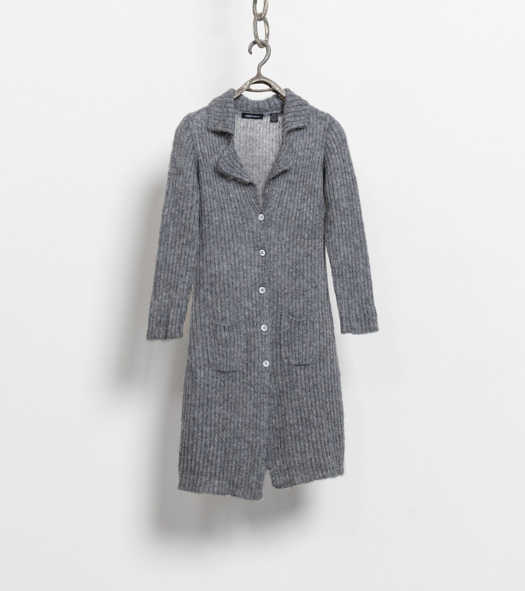 A long, loose-fitting grey mohair blend cardigan with buttons down the front and a collar, displayed on a hanger against a white background.