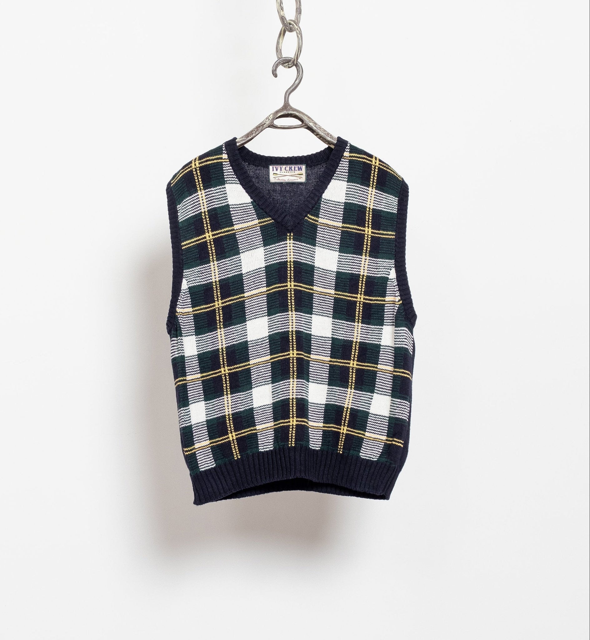 A vintage 90's cotton/ramie blend pullover plaid sweater vest in classic blue and green tartan pattern, displayed on a white background with a chain link attachment.