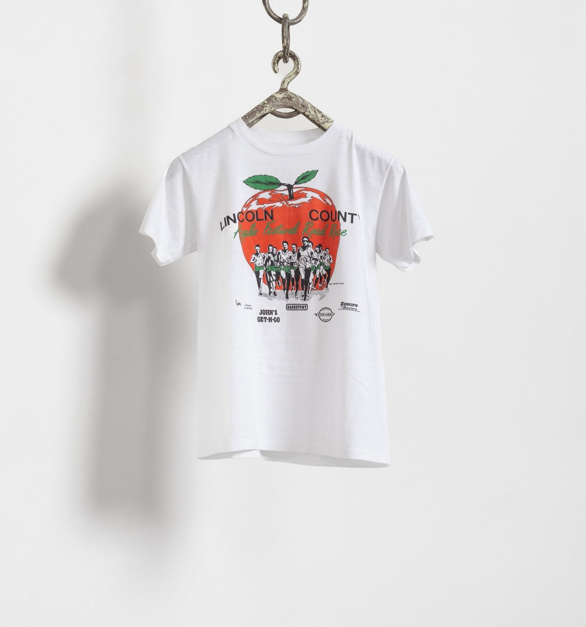 White t-shirt with a graphic design on a white background